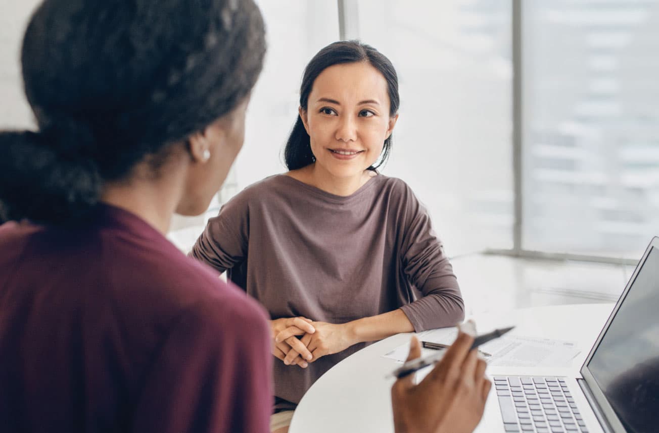 a female student getting counselled by a staff member