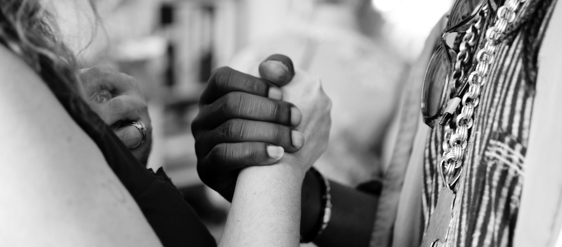 Two women holding hands