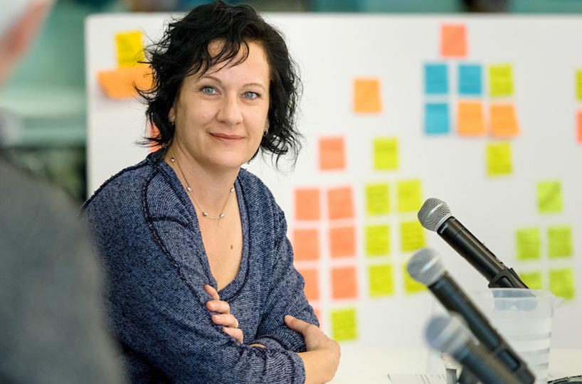 Woman looks intently during a panel discussion