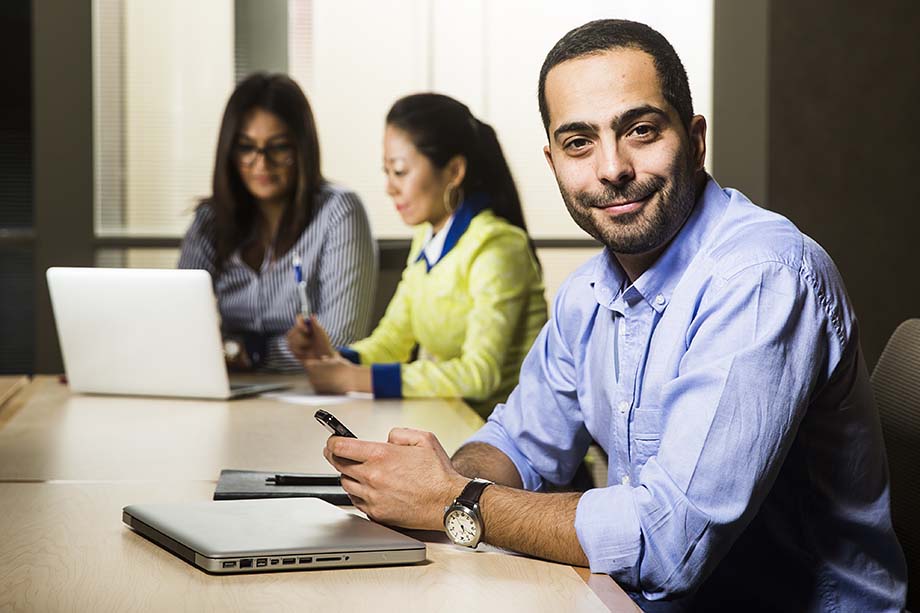 Three graduate students in meeting room