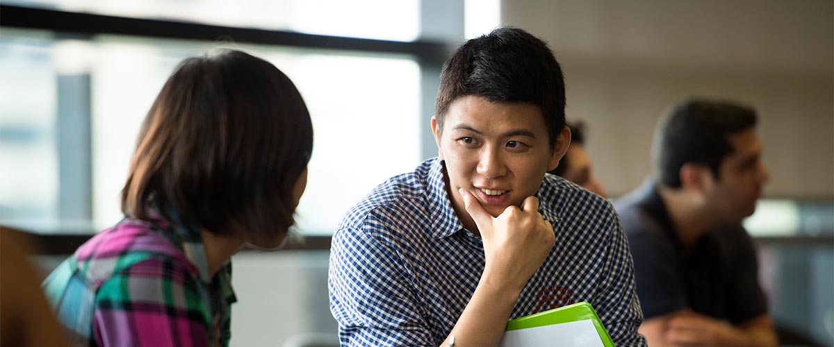 Students talking at a networking event