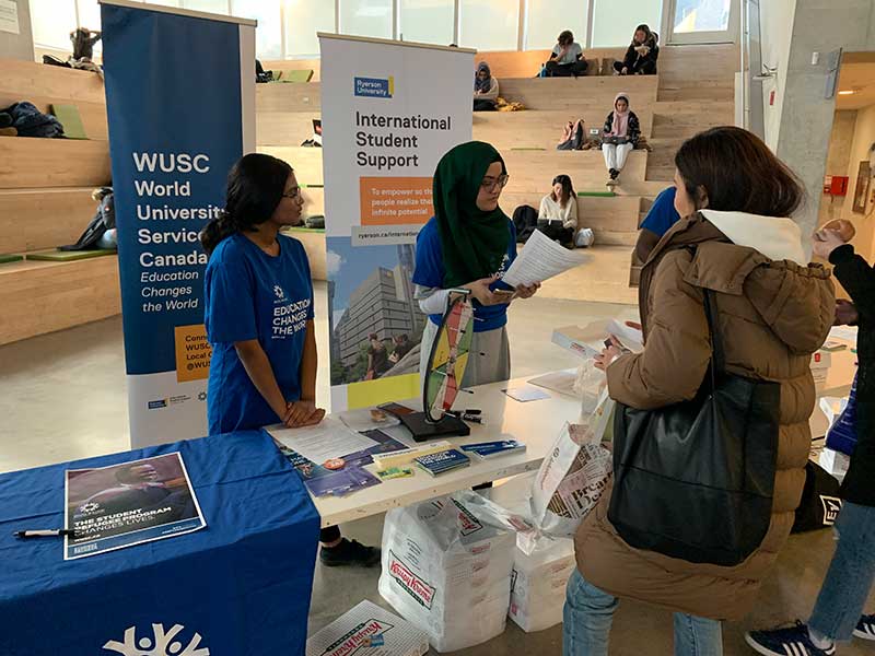 WUSC table and banners at the SLC.