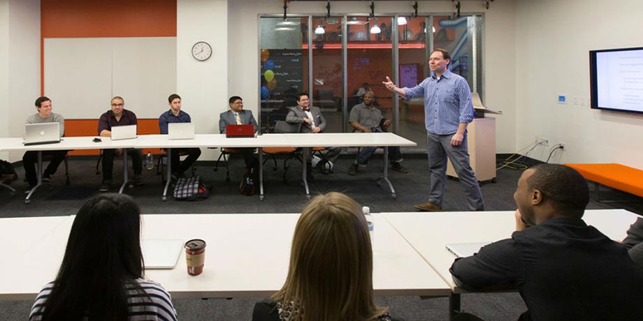 Instructor speaks to a class 