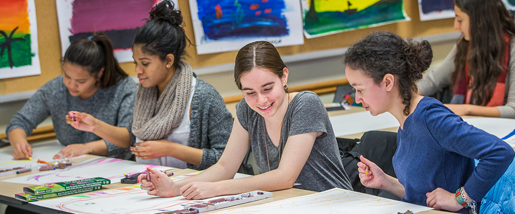 Diverse students interacting while doing arts and crafts